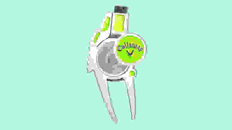 Callaway 4-in-1 golf divot repair tool on a light green background.