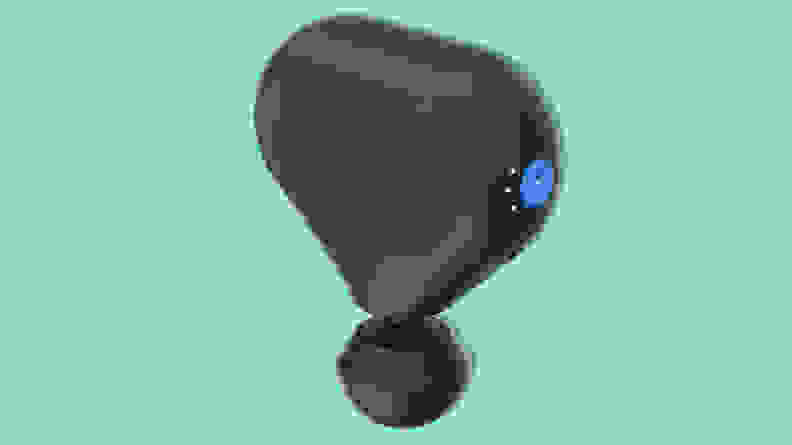 TheraGun Mini on a teal background.