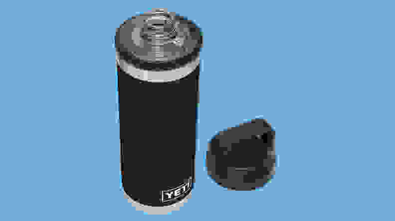 YETI Rambler vacuum insulated stainless steel bottle with Chug Cap on a blue background.