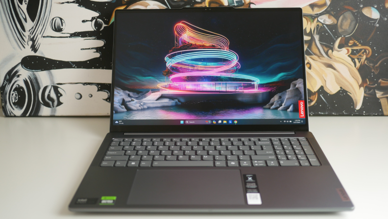 The laptop displaying a screensaver.
